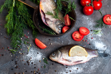 Delicious fresh fish on dark vintage background.