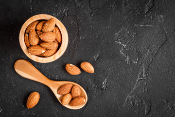 almonds on dark background top view