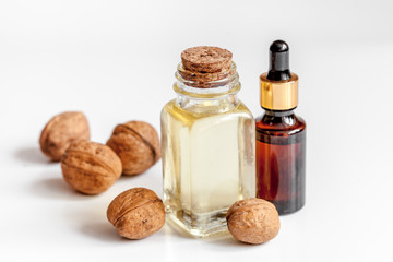 cosmetic and therapeutic walnut oil on white background