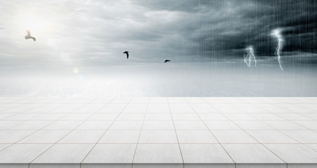Business concept - Empty concrete floor top with panoramic sky view under sunrise and storm thunder grey sky for display or montage product
