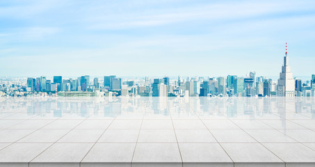 Business concept - Empty concrete floor top with panoramic modern cityscape building bird eye aerial view under sunrise and morning blue bright sky of Tokyo, Japan for display or montage product