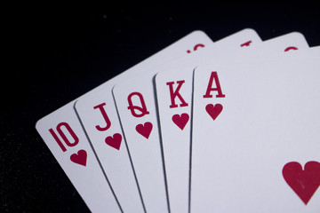 royal flush poker card on dark black background