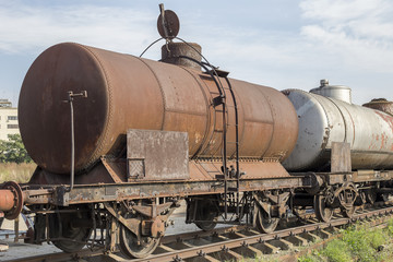 Fototapeta na wymiar Abandoned rusty railway containers