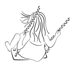 Silhouette of a child riding a swing