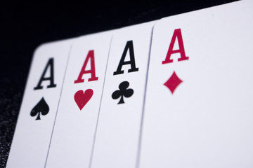 Obraz premium ace four of a kind poker card on dark black background