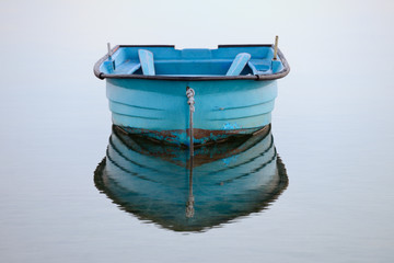 wooden fishing boat on a background of water - Powered by Adobe