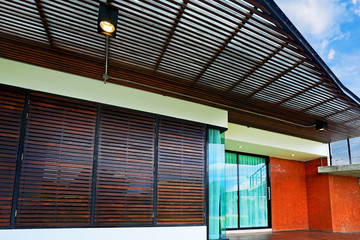 Architecture modern design in cement and wood with little garden and lawn