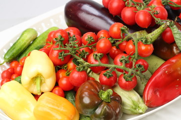 Fototapeta na wymiar Plate with mixed organic assortment of Vegetables