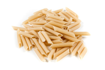 Brown rice penne isolated on a white background
