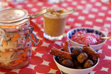 Home made pickled herring, meatballs, sausage and mustard on the