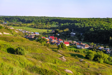 Russian village in a valley between the forest and the ancient Cretaceous deposits