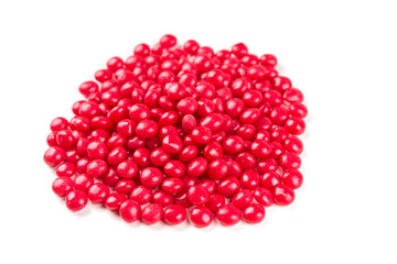 Red cinnamon candies isolated on a white background