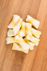Lemon flavored wafer puffs isolated on a wood background