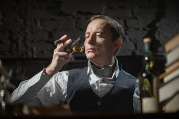 Business man in his office smoking a cigar