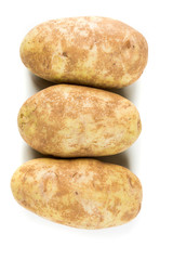 Three potatoes isolated on a white background