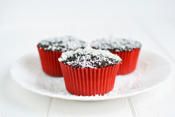 Homemade cupcakes with chocolate glaze and coconut