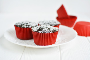 Homemade cupcakes with chocolate glaze and coconut