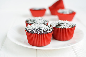 Homemade cupcakes with chocolate glaze and coconut