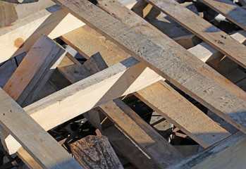 Fototapeta na wymiar wooden pallets in a woody material landfill