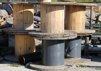 many wooden reels for electrical cables in landfill