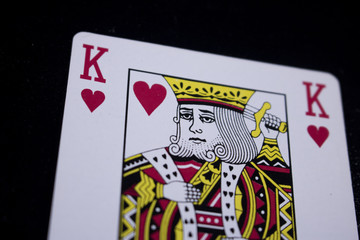 king poker card on dark black background