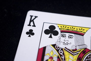 king poker card on dark black background