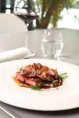 Fine dining - meat dish with pomegranate