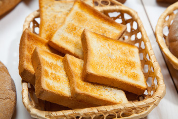 Toast bread on a white wooden background