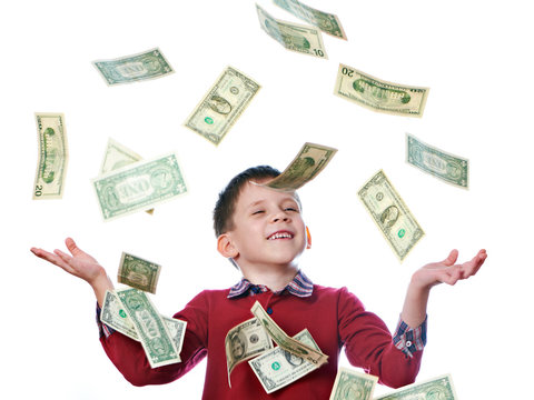 Little boy and flying dollar bills isolated