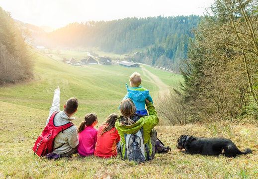 Large Family Having Trekking Vacation Day In Switzerland Mountain