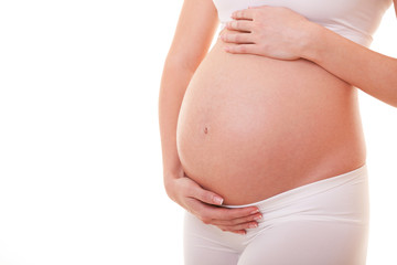 Image of pregnant woman touching her big belly. Close up. Mother