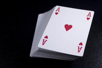poker card stack deck on dark black background