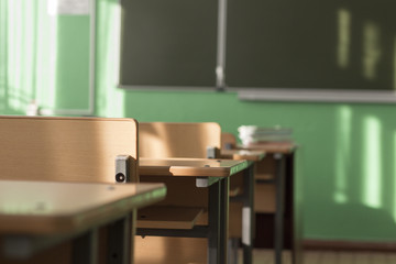 empty classroom lit by sun