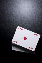 poker card stack deck on dark black background