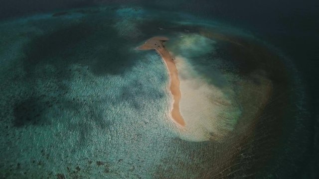 Aerial view of beautiful sand tropical island with white sand beach. White sand island. Beautiful sea ,resort. Seascape: ocean and beautiful beach paradise. Philippines, Camiguin. 4K video. Travel