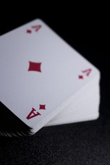 poker card stack deck on dark black background