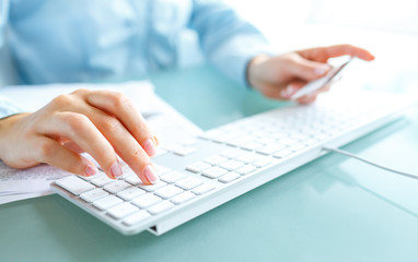 Hands using computer and credit card