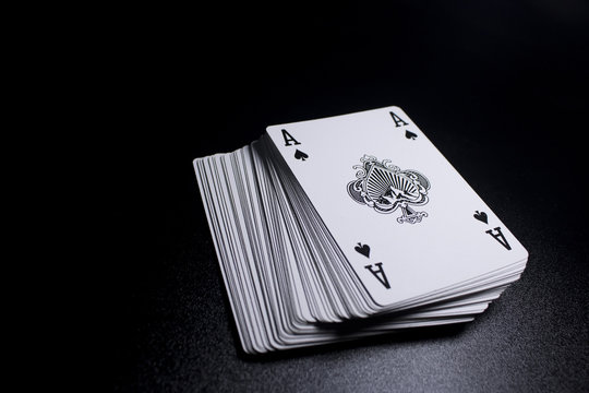 poker card stack deck on dark black background