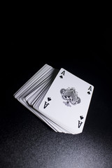 poker card stack deck on dark black background