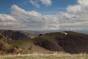 The formation and movement of spring clouds over the high Caucasus mountains