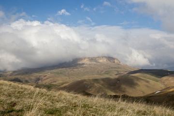 The formation and movement of spring clouds over the high Caucasus mountains