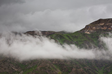The formation and movement of spring clouds over the high Caucasus mountains