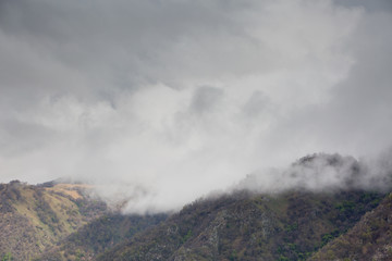 The formation and movement of spring clouds over the high Caucasus mountains