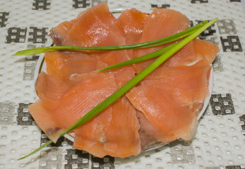 Sliced salted fish salmon on the plate
