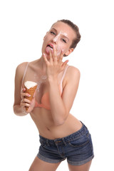 beautiful woman eats icecream in studio , ice cream dripping on the face and breast girl.