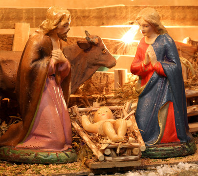nativity scene with holy family in a manger