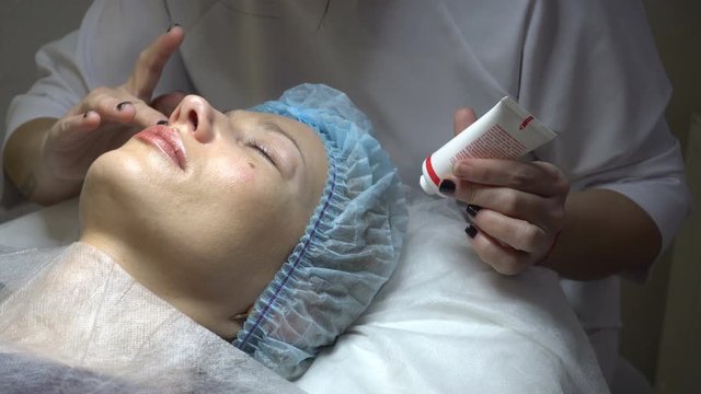 Young woman getting treatment in beauty saloon