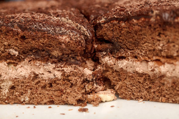 Slices of chocolate cake with cream closeup