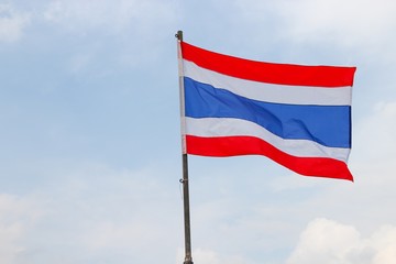 Thai flag, waving in the wind with beautiful with blue sky background
