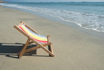 Fototapeta na wymiar Deck chair at the tropical beach